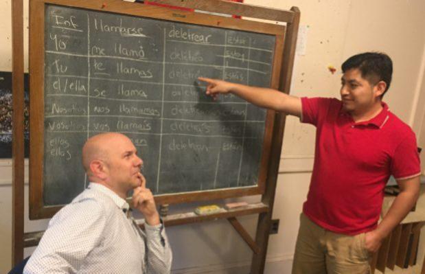 Lucio teaching Spanish to radio host Monte Belmonte.